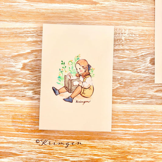 A child sitting and reading - Krimgen postcard
