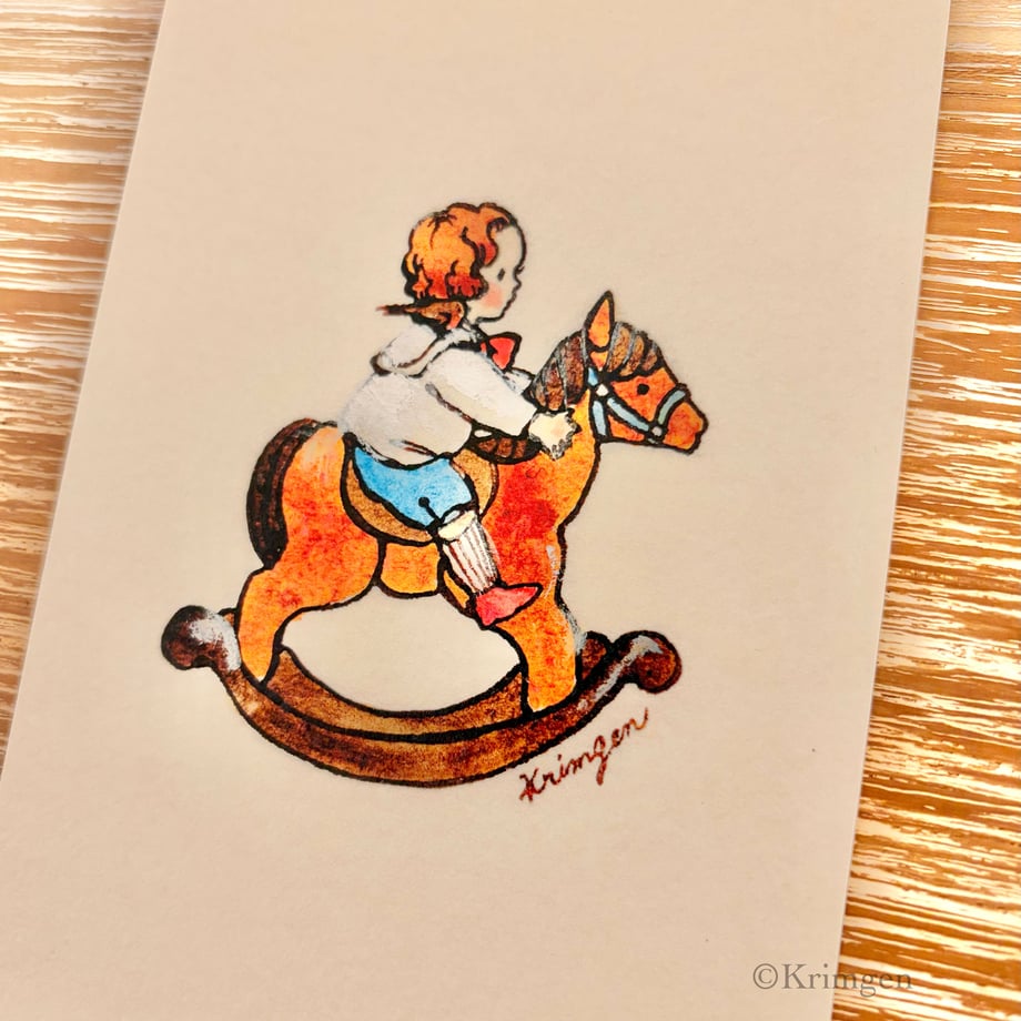 Boy riding a rocking horse - Krimgen postcard