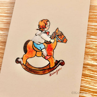 Boy riding a rocking horse - Krimgen postcard